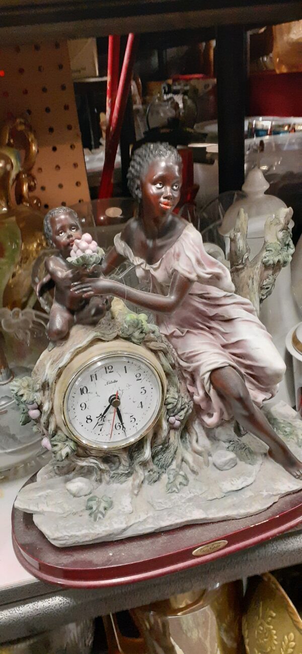 antique booth clock with black child and mother